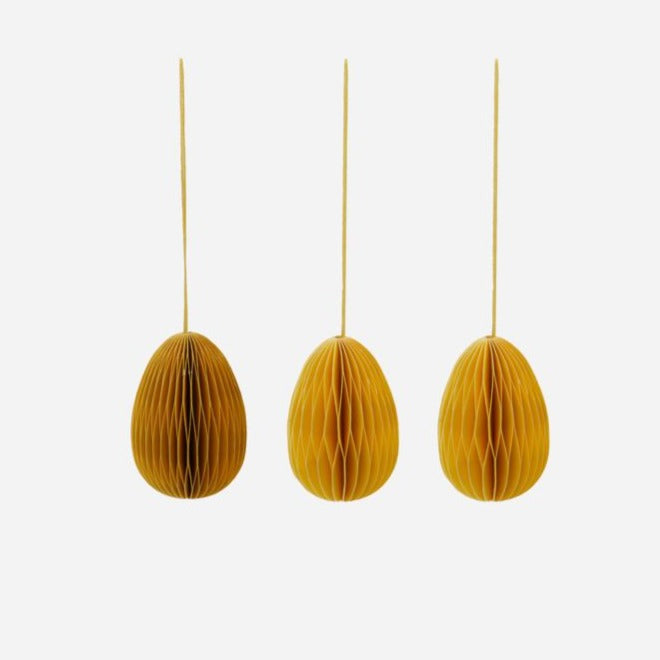 Ensemble de trois décorations d'oeufs de Pâques en nid d'abeille