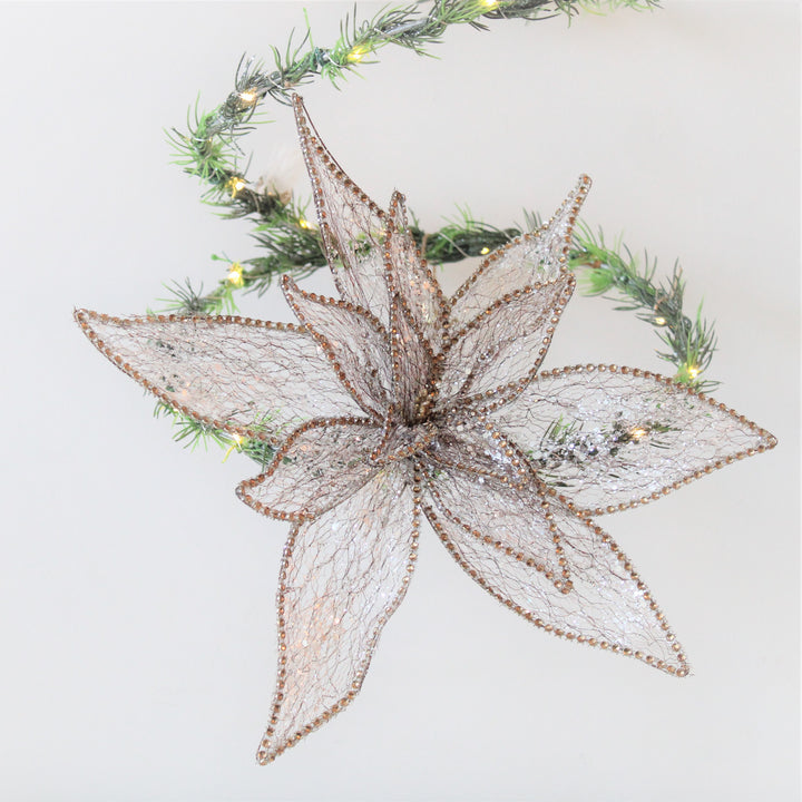 Décoration de poinsettia à paillettes dorées