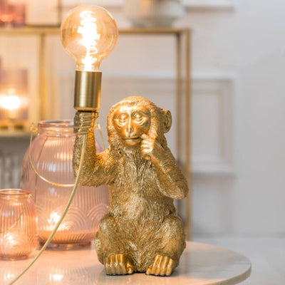 Lampe de table singe doré