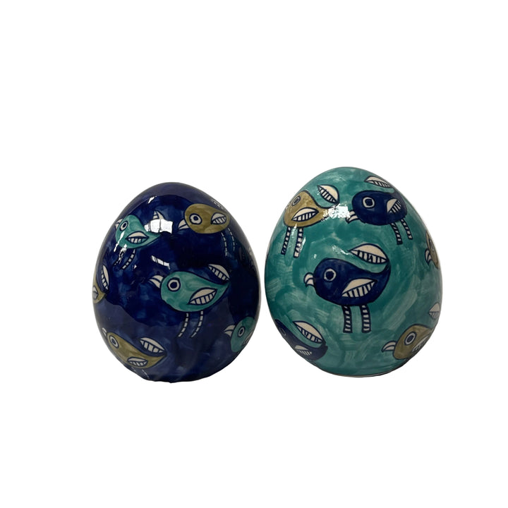 Two decorative eggs with fish patterns