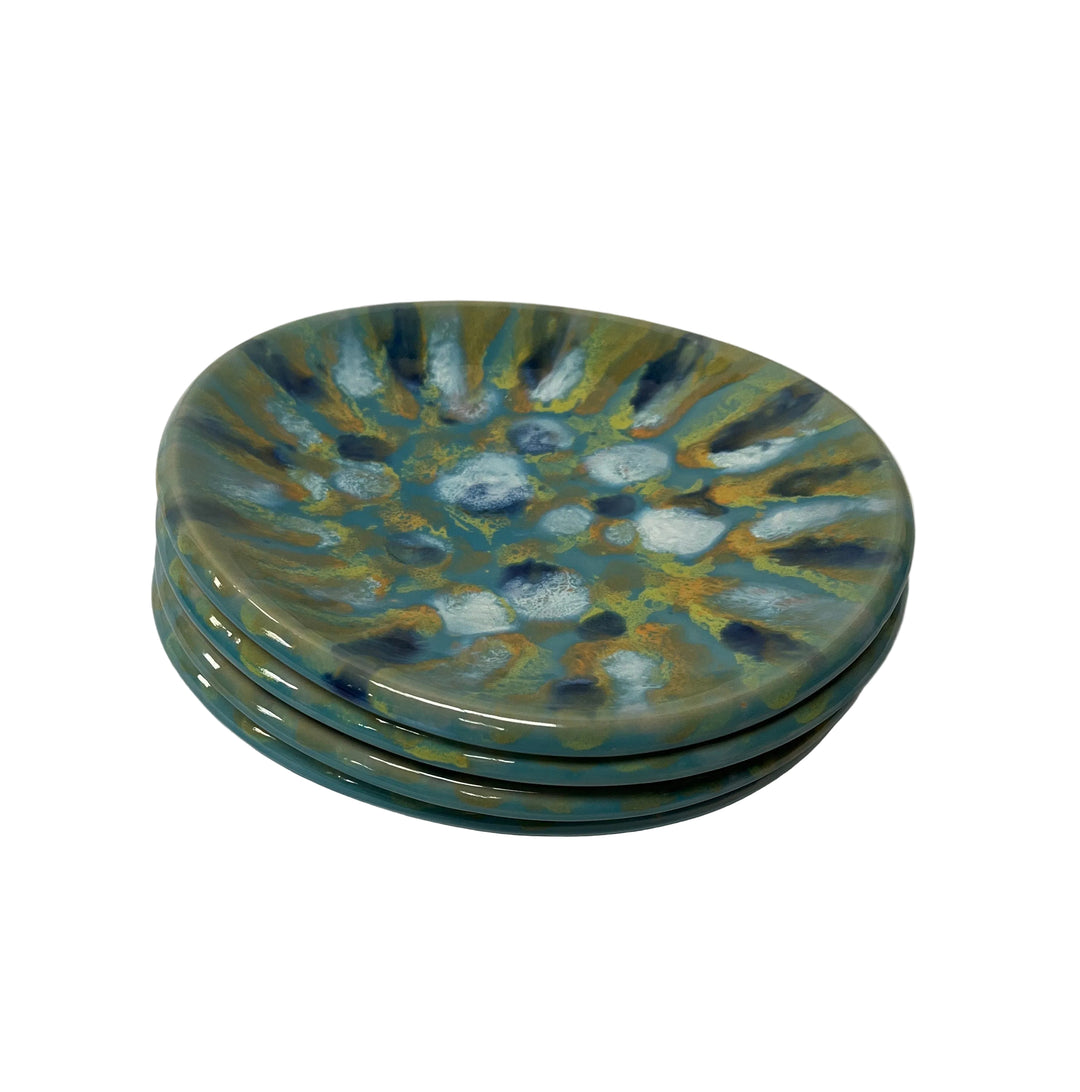 Set of three ceramic plates with a decorative blue and green pattern