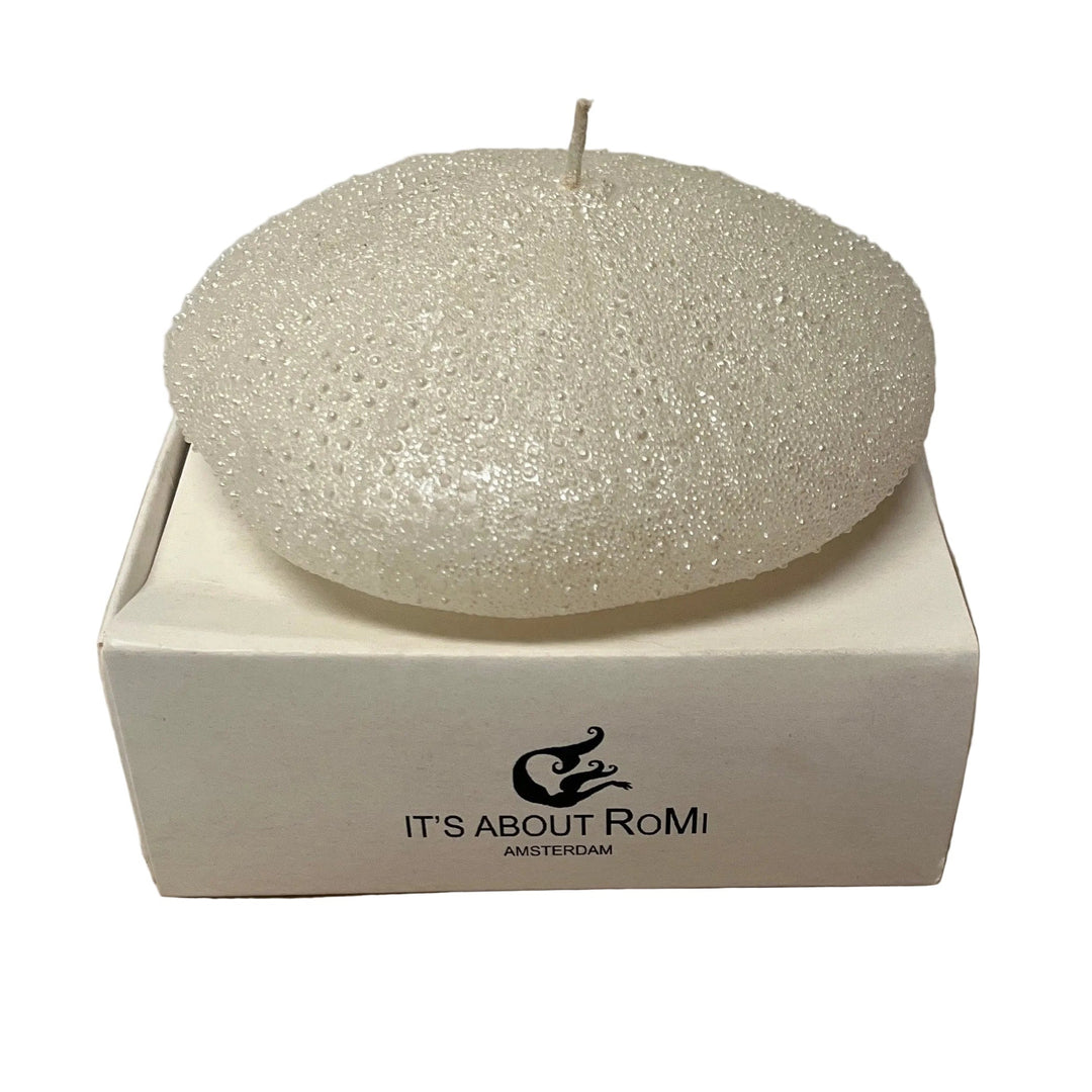 Decorative candle in a box with 'It's About RoMi' branding 