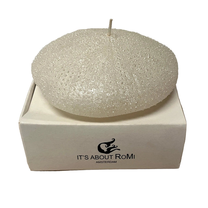 Decorative candle in a box with 'It's About RoMi' branding 