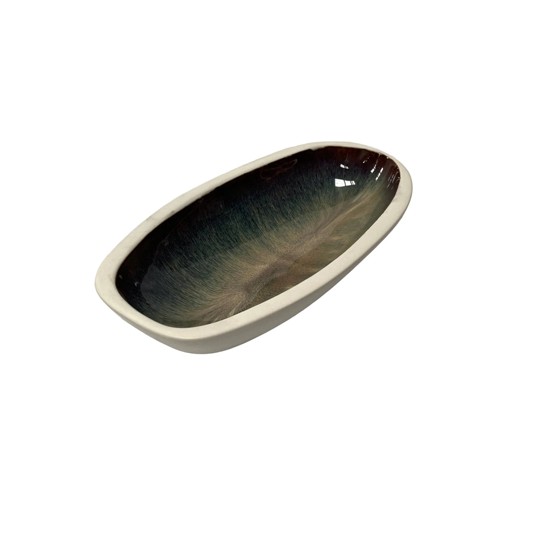 Oval ceramic bowl with gradient color from dark to light 