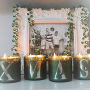 Sæt med fire "XMAS"-duftlys i gaveæske